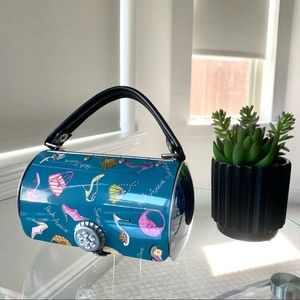 Cute little hard purse with rhinestone magnetic closure.